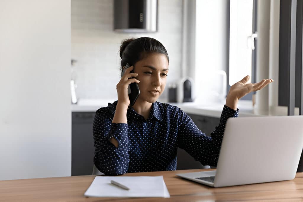 virtual medical transcriptionist working using a laptop and phone