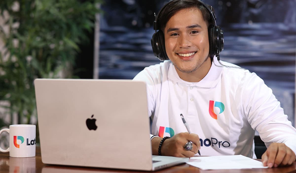 Man with headphones and laptop.