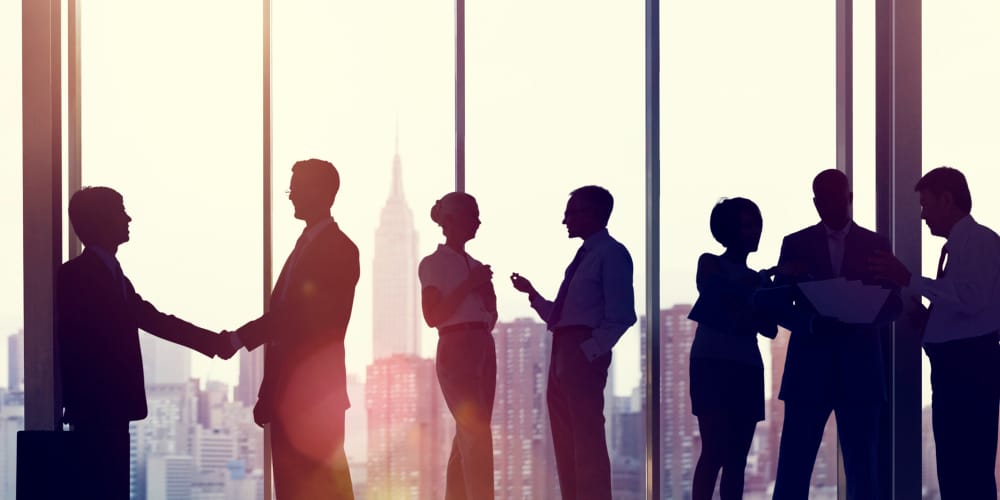 closeup-handshake-office-desk-concept-agreement-partnership-business-deals-coaching-and-consulting