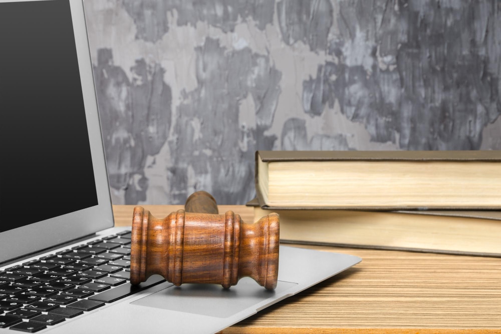 paralegal vs legal tools a laptop and a law hammer
