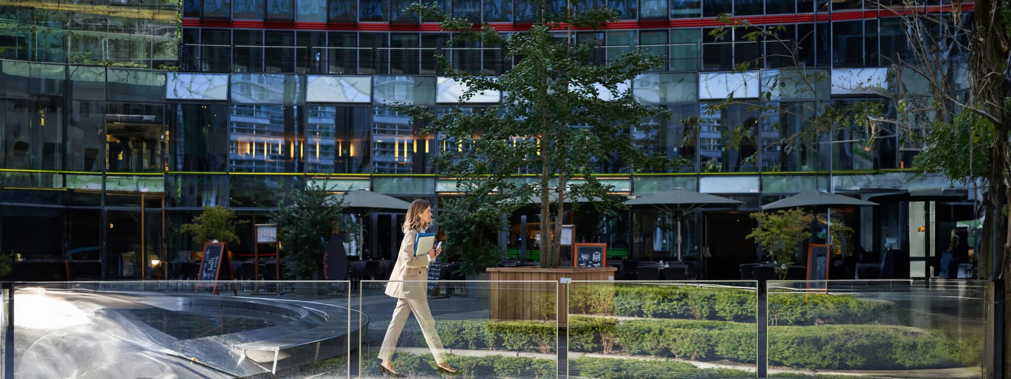 young-real-estate-woman-beige-suit-walking-city-center-posing-near-office-buildings