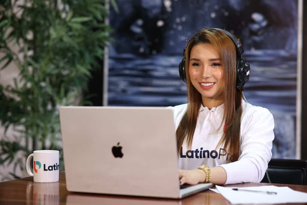 a CSR VA using a laptop while wearing headphones
