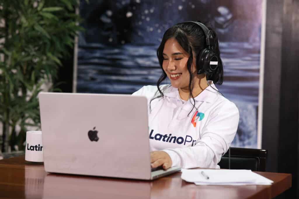a virtual assistant from latino pro smiling while doing some work