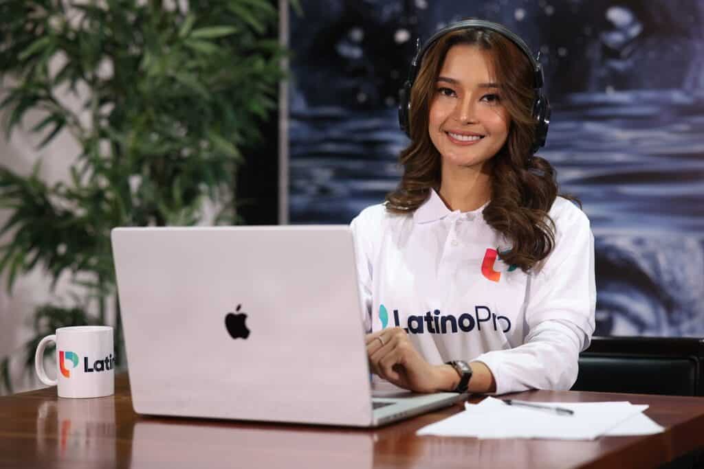 an administrative VA using a laptop while wearing headphones