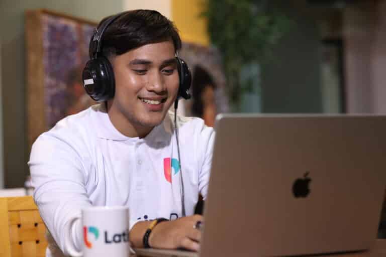 Marketing assistant job description shown—man in headset working remotely with LatinoPro branding.