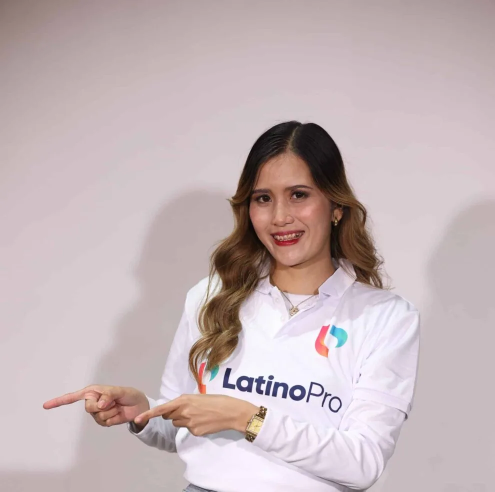 Smiling woman pointing, illustrating the differences in appointm