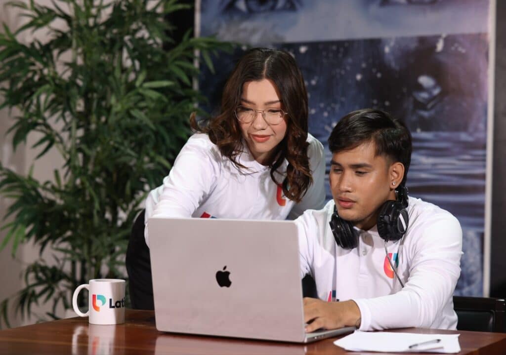The Rise of the Paralegal Virtual Assistant Two professionals collaborate on a laptop