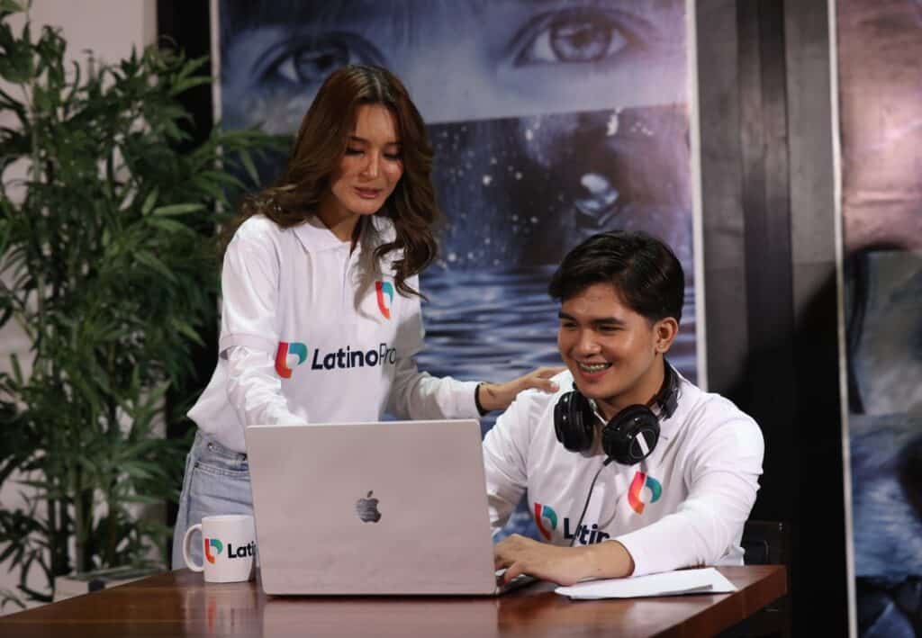 Two people collaborating on a laptop; perfect for anyone who needs A Video Editor Virtual Assistant