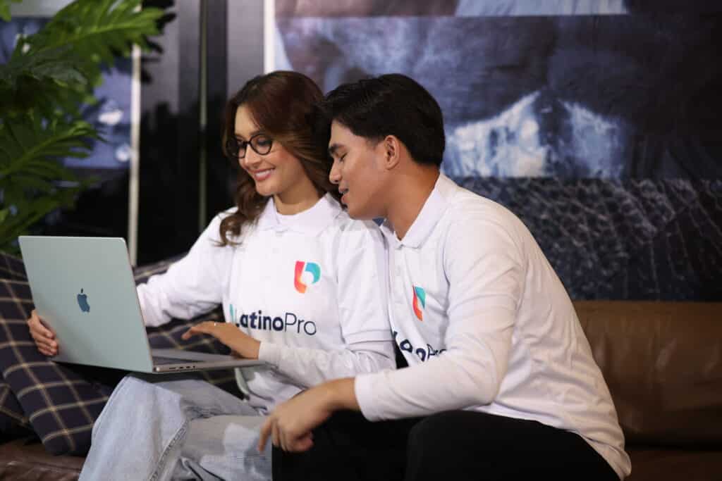Two professionals collaborate on a laptop, highlighting teamwork and growth tied to accounting virtual assistant salary benefits.
