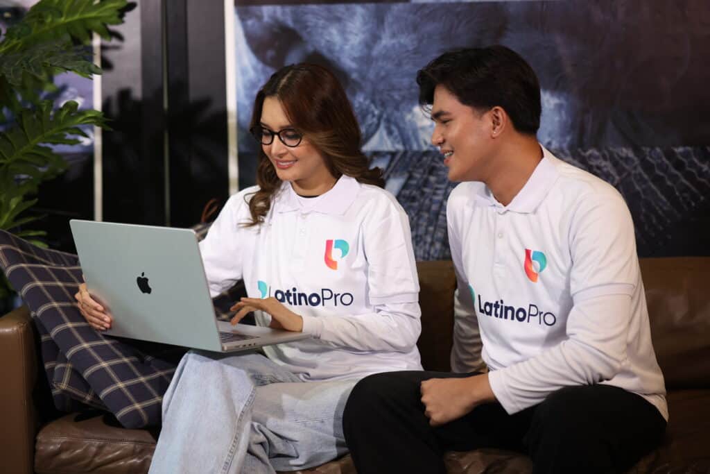 Two professionals collaborating on a laptop, perfect for understanding