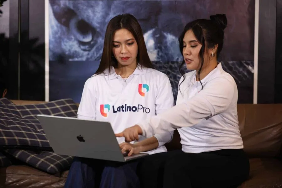 Two professionals reviewing tasks on a laptop, showing collaboration and insight into what does a medical scribe do daily.