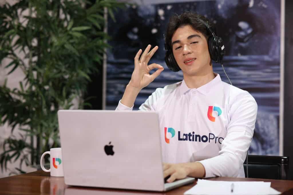 Professional from LatinoPro on a video call, explaining care coordinator vs case manager roles confidently.