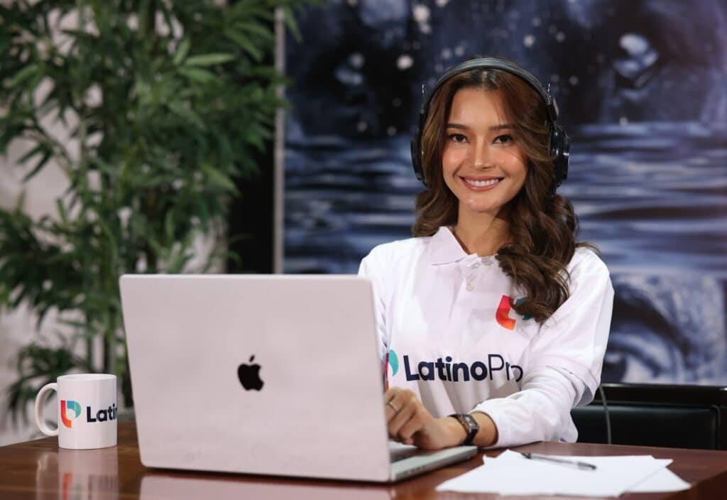 Smiling Legal Research Assistant with headphones on, working on a laptop. Legal Research Assistant service