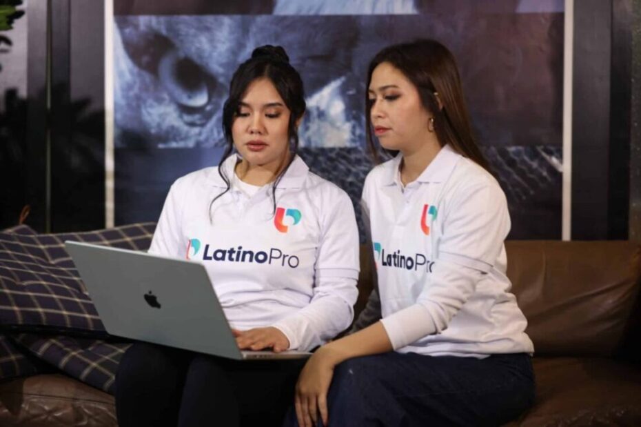 Team reviewing how legal consultation can assist in insurance claims using a laptop in a relaxed, professional workspace.