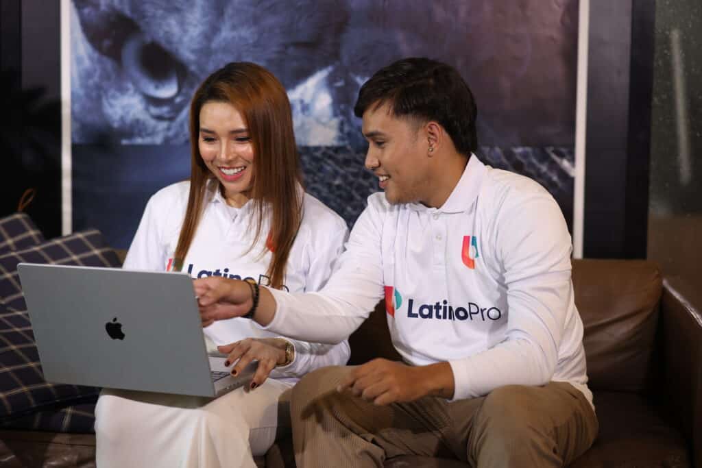 Team reviewing laptop for outsourced legal intake, highlighting efficiency and collaborative support.