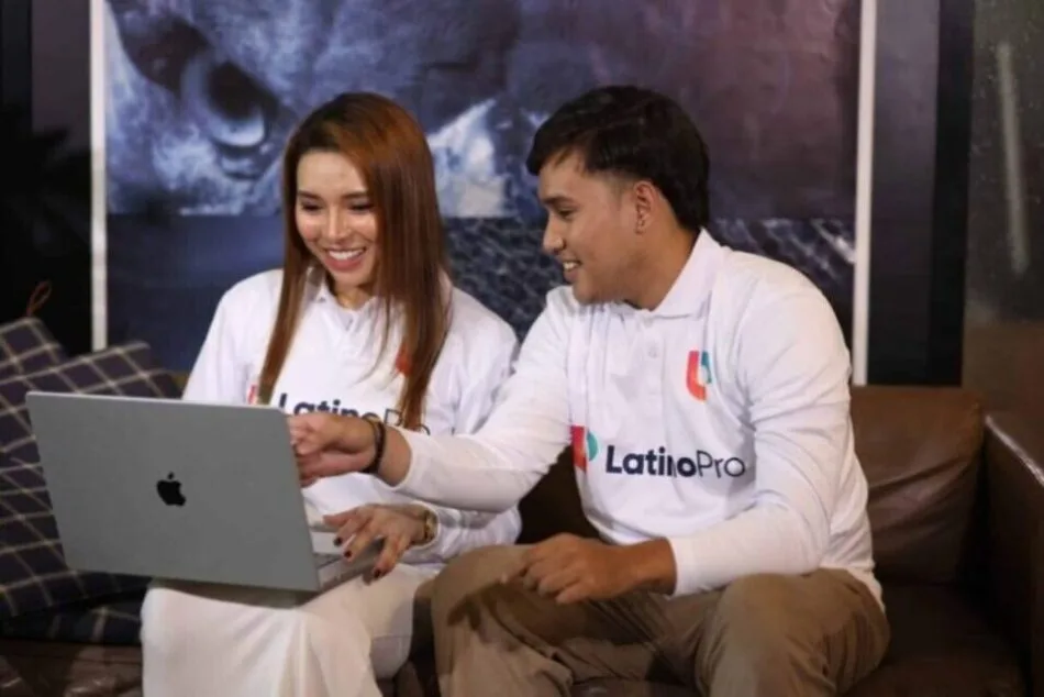 Team reviewing laptop for outsourced legal intake, highlighting efficiency and collaborative support.