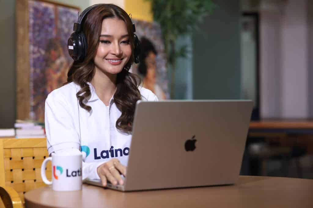 Woman in headset working on laptop, representing remote paralegal consultation services for legal firms and attorneys.